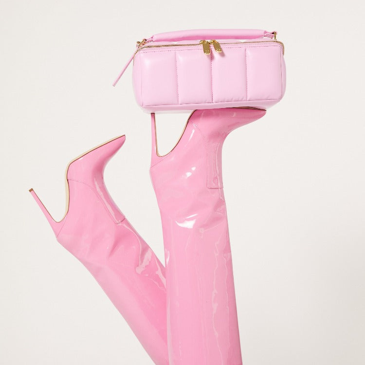 BIGEE travel case resting on a pair of Paris Texas pink stiletto boots